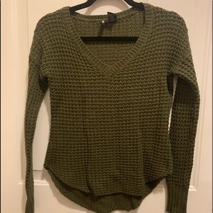 Dark green knitted sweater with v-neck